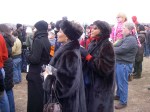 Elegantly dressed women beside us, to help welcome Obama