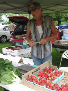 Tim Cahill, selling strawberries grown by himself, Peggy Cahill and Mike Cahill in Maidstone, VT