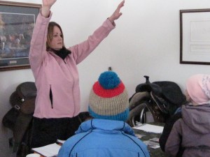 Karen Guile, announcing prizes to snowshoe kids.